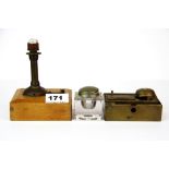 A small early battery operated light house lamp with two inkwells.