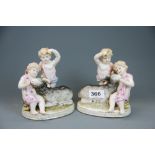 A pair of early 20th century German porcelain figures of Putti with goats, H. 17cm.