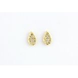 A pair of 18ct yellow gold diamond set stud earrings, L. 0.8cm.