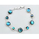 A 925 silver bracelet set with cabochon cut labradorite, L. 18cm.