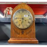 A brass inlaid D.R.P brass faced bracket clock, H. 41cm.