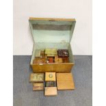 A tin trunk containing a quantity of wooden boxes and mixed tins.