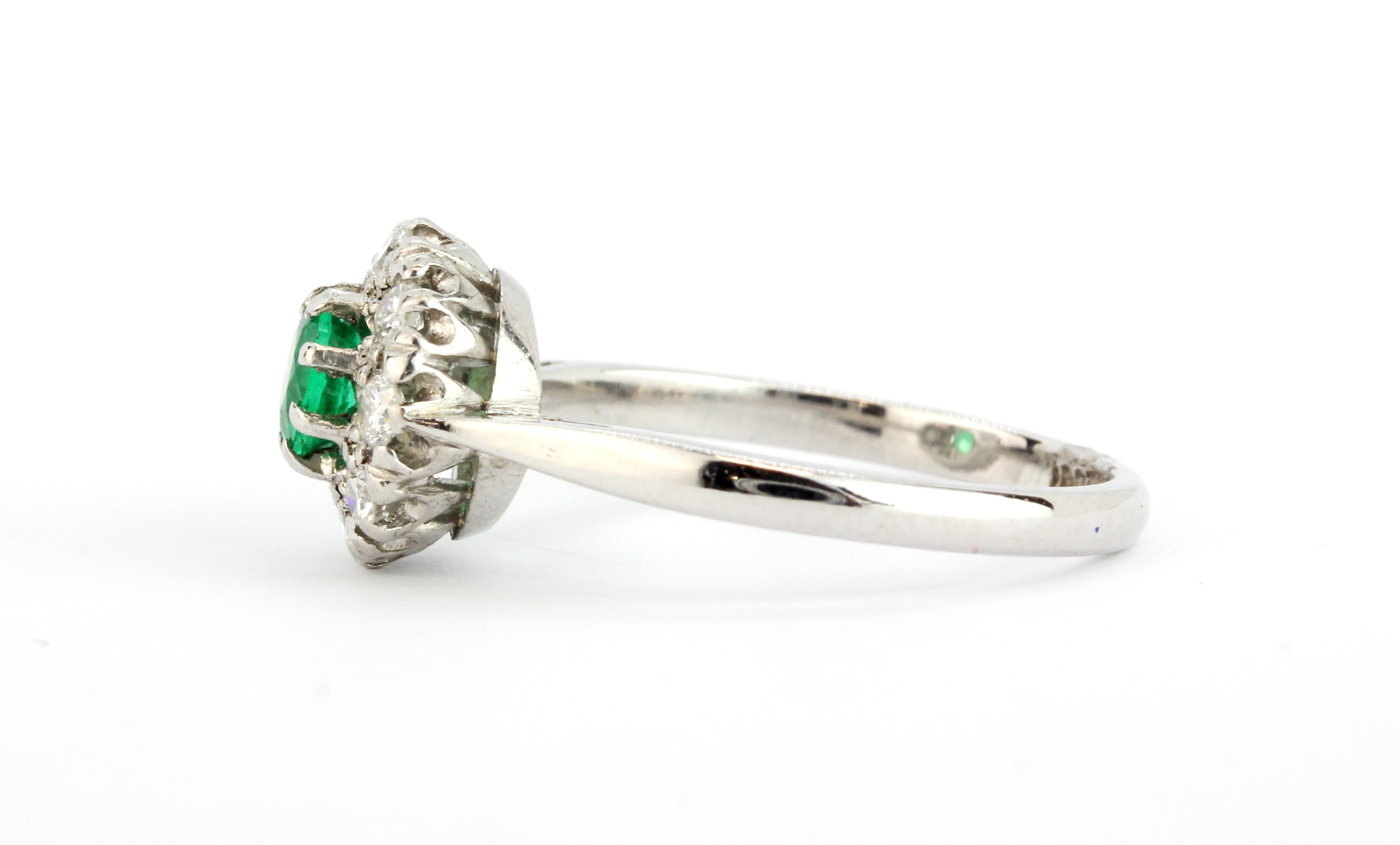 An 18ct white gold and platinum cluster ring set with a round cut emerald surrounded by brilliant - Image 2 of 2