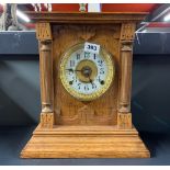 A 19th century oak cased striking mantle clock by Fattorini and sons Bradford, H. 33cm.