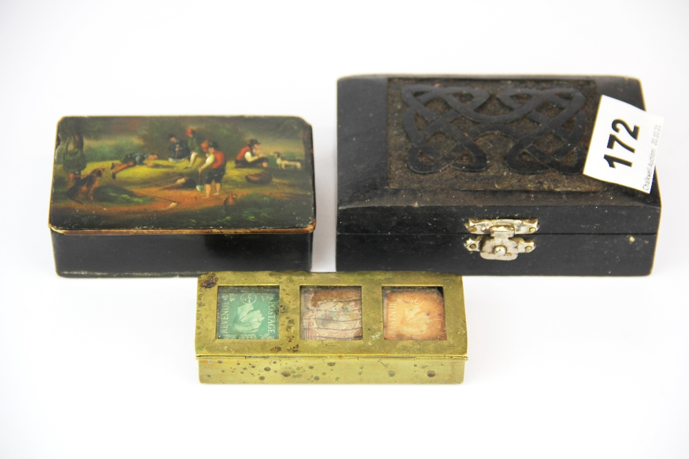 A brass stamp box together with a papier mache snuff box and a carved ebony box.