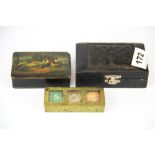 A brass stamp box together with a papier mache snuff box and a carved ebony box.