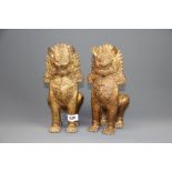 A pair of antique Burmese gilt bronze lion figures, H. 27cm.
