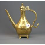 An early Indian polished bronze jug with engraved decoration, H. 30cm.