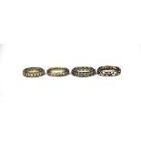 Four gold and silver stone set eternity rings.