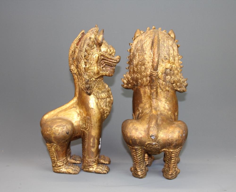 A pair of antique Burmese gilt bronze lion figures, H. 27cm. - Image 2 of 2