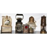 An early brass Thomas & Williams miners lamp type no. 6A together with three further lamps and an