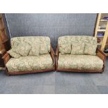 A pair of 1920's bergere sofas, W. 140cm. H. 83cm