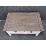 A contemporary painted oak coffee table with four drawers, 102 x 65 x 51cm.