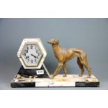 An Art Deco bronzed spelter and marble mantle clock, L. 47cm. H. 26cm.