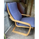 A laminate wood armchair.