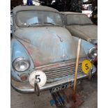 A Morris Minor 1000 with log book, 56,000 miles.