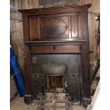 A 1920's wooden fire surround with copper inset, H. 102cm. W. 128cm.