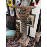 An antique French wooden cider press screw converted as a bar table, H. 132cm.