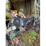 A vintage three wheeled disabled motorbike and trailer.