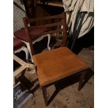 A set of four 1970's teak dining chairs.