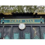 A handpainted wooden North Star sign.