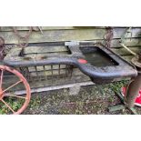 An antique cast iron cattle hay and water feeder, W. 120cm.