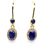 A pair of 925 silver gilt drop earrings set with oval cut sapphires and white stones, L. 3.3cm.