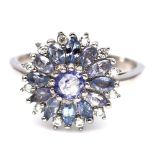 A 925 silver tanzanite set cluster ring, (P.5).