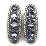 A pair of 925 silver earrings set with tanzanites and white stones, L. 3cm.