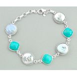 A 925 silver bracelet set with turquoise and pearls, L. 19cm.