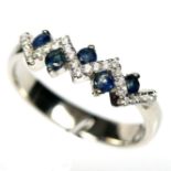 A 925 silver zigzag ring set with sapphires and white stones, (O).