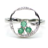 A 925 silver ring set with emeralds and white stones, (N).