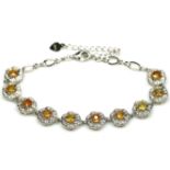 A 925 silver yellow sapphire and white stone set bracelet, L. 19cm.