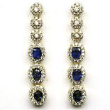 A pair of 925 silver gilt drop earrings set with oval cut sapphires and white stones, L. 3.5cm.