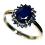 A 925 silver sapphire set cluster ring, (Q.5).