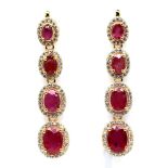 A pair of 925 silver gilt drop earrings set with oval cut rubies and white stones, L. 4.5cm.