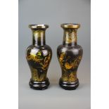 A pair of Oriental hand painted turned wooden vases, H. 38cm.