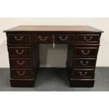 A leather topped mahogany desk, 121 x 79.5 x 61cm