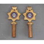 A pair of enamelled gilt copper Masonic staff heads, L. 16.5cm.