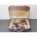 A vintage travelling case and tool contents.