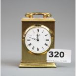 A small gilt brass Astral carriage clock, H. 9cm.