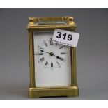 A gilt brass carriage clock, understood to be in working order, H. 15cm.