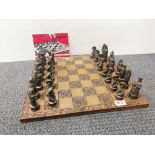 An interesting Chinese design chess set and board, king H. 9cm.