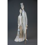 A Lladro porcelain figure of 1033 'Old Folks', H. 50cm. Gentleman A/F to thumb.