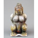 An unusual Chinese carved mixed colour jade figure of a naked woman in bondage (possibly an Imperial