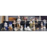 A group of mixed porcelain figurines, including Royal Dux.