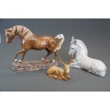 A large Heredities porcelain horse, together with an Italian porcelain horse and a Beswick stag,