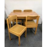 A Dinette table and four chairs, W. 113cm.