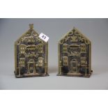 Two 19th century brass and steel savings bank money boxes, H. 20cm. Dated 1864 and 1865.