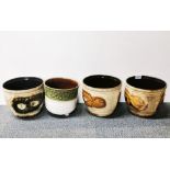 A group of four vintage West German pottery plant holders, largest 23 x 20cm.